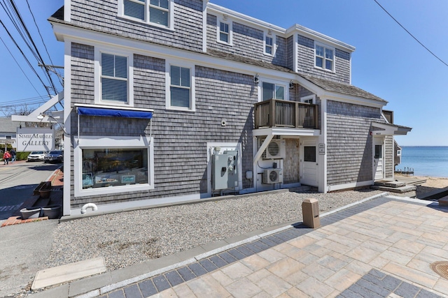 view of front of property with a water view