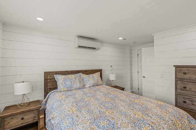 bedroom featuring wood walls, an AC wall unit, and crown molding