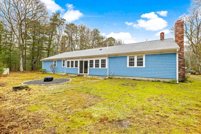 49 Heather Ln, Centerville, MA 02632 - back of house featuring a yard, roof with shingles, and a chimney