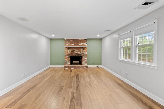 49 Heather Ln, Centerville, MA 02632 - unfurnished living room featuring light wood-type flooring, baseboards, recessed lighting, a fireplace, and visible vents