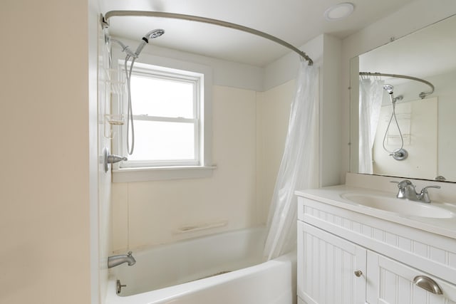 bathroom featuring vanity and shower / bath combination with curtain