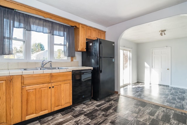62 Windsor Rd, Sandwich, MA 02563 - kitchen with plenty of natural light, tile countertops, sink, and black appliances