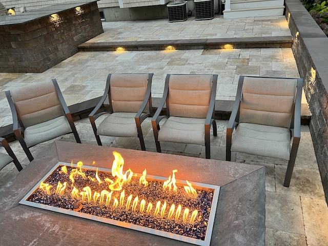 66 Frog Pond Close, Mashpee, MA 02649 - detailed view of an outdoor fire pit, a chandelier, and central AC unit