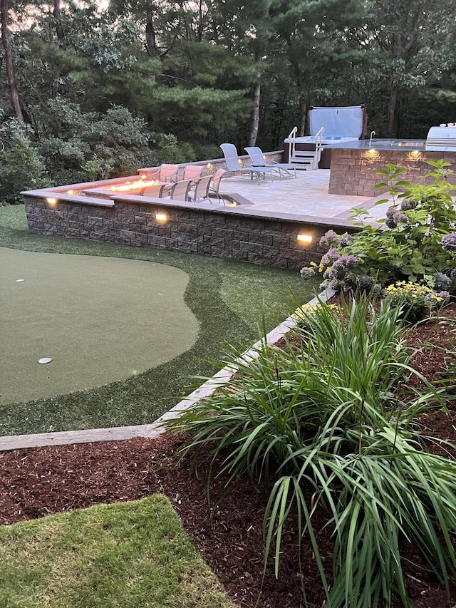 66 Frog Pond Close, Mashpee, MA 02649 - view of yard with an outdoor fire pit, a putting green, and a patio area