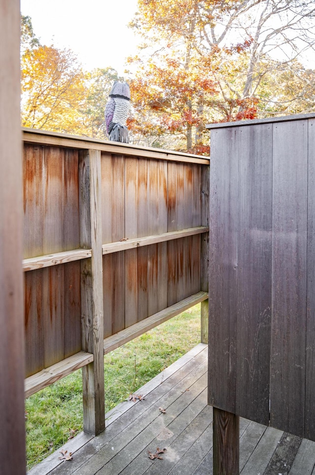 view of gate with a wooden deck