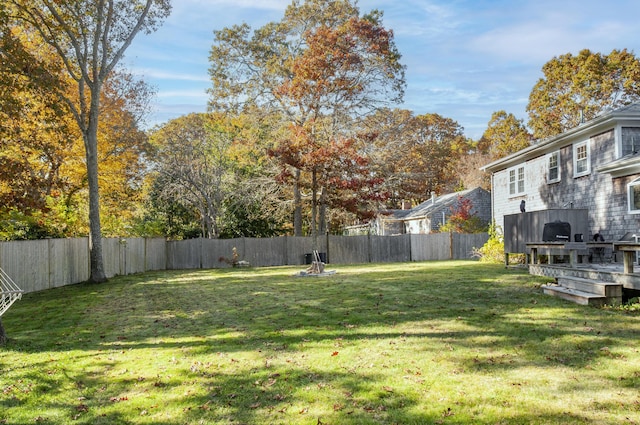 view of yard with a wooden deck