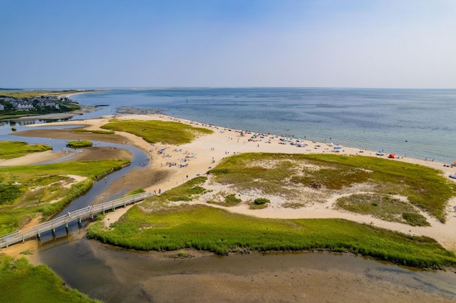 bird's eye view with a water view and a beach view