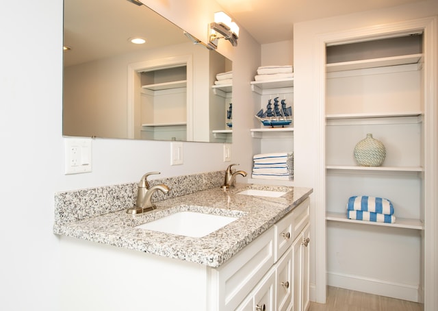 bathroom featuring vanity and hardwood / wood-style floors