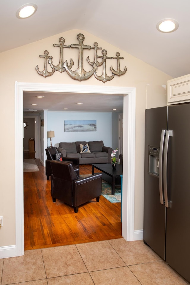 tiled living room with lofted ceiling