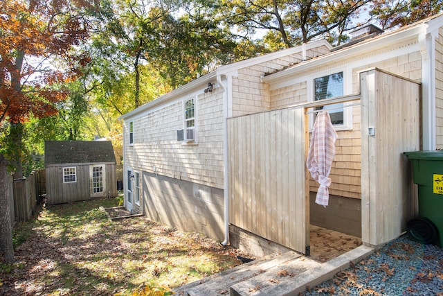 view of property exterior featuring a storage shed