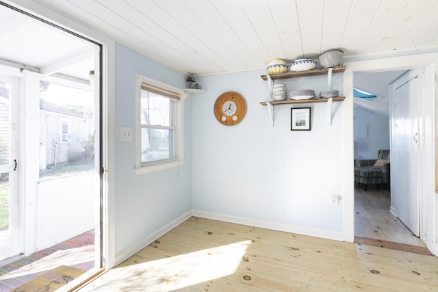 interior space with wooden ceiling and light wood-type flooring