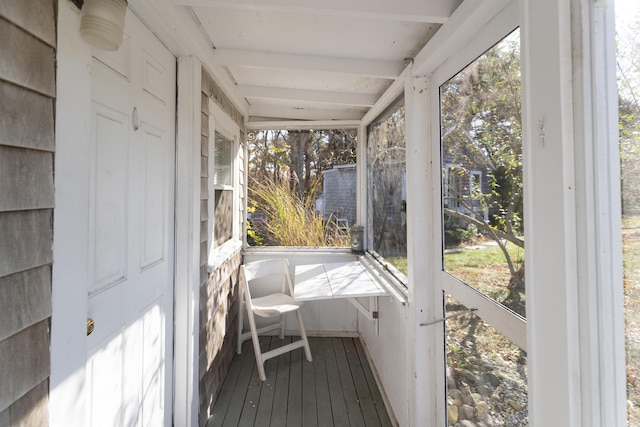 sunroom with beam ceiling