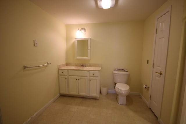 110 Dillingham Ave Unit 215U, Falmouth, MA 02540 - bathroom featuring vanity, toilet, and baseboards
