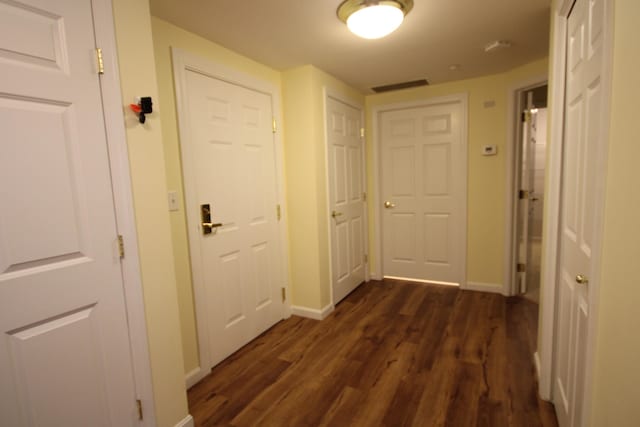 110 Dillingham Ave Unit 215U, Falmouth, MA 02540 - hallway featuring dark wood-style flooring and baseboards