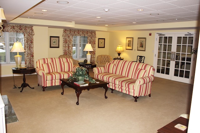 110 Dillingham Ave Unit 215U, Falmouth, MA 02540 - carpeted living area with a paneled ceiling and french doors