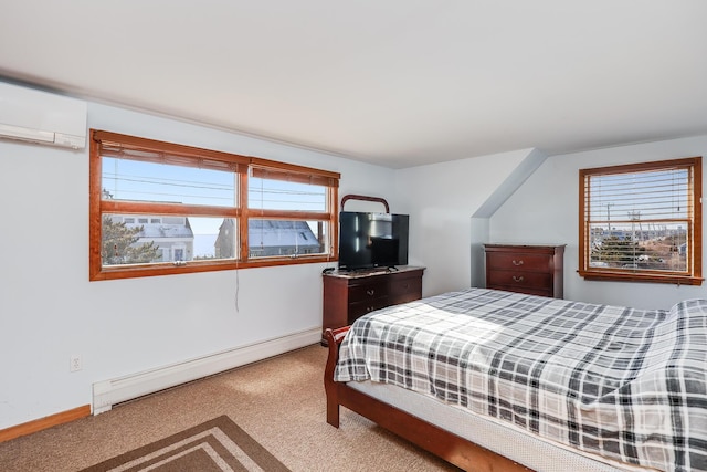 carpeted bedroom featuring a wall unit AC and a baseboard heating unit