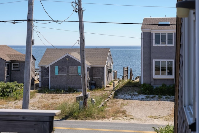 view of home's exterior with a water view