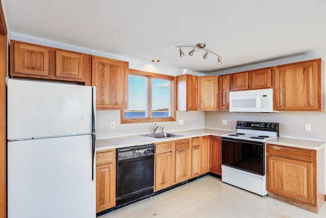 kitchen featuring sink and white appliances