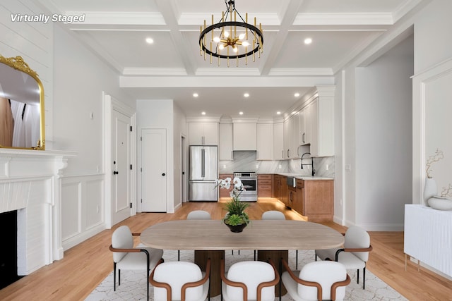 dining area featuring beamed ceiling, an inviting chandelier, light wood-style floors, crown molding, and coffered ceiling