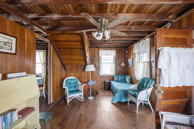 5 Spurr Rd, Pocasset, MA 02559 - living area featuring wood ceiling with exposed beams, wood walls, wood-type flooring, and a ceiling fan