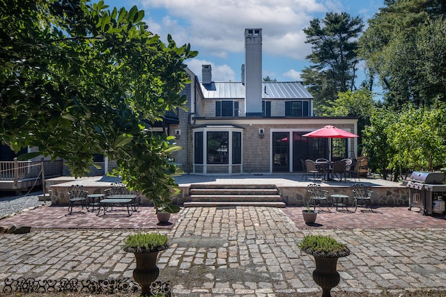 rear view of house featuring a patio