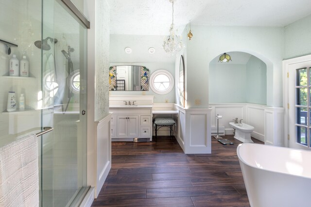 bathroom featuring wood-type flooring, a wealth of natural light, a bidet, and independent shower and bath