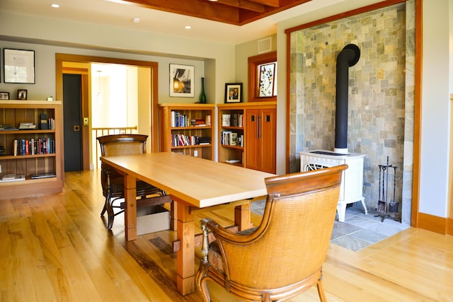 71 Stoney Hill Rd, Tisbury, MA 02568 - dining room with a wood stove and wood finished floors
