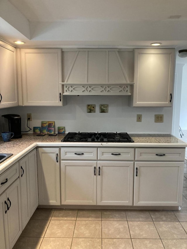 5 Penobscot Way, Harwich, MA 02645 - kitchen featuring black gas cooktop, custom exhaust hood, light tile patterned floors, and light countertops