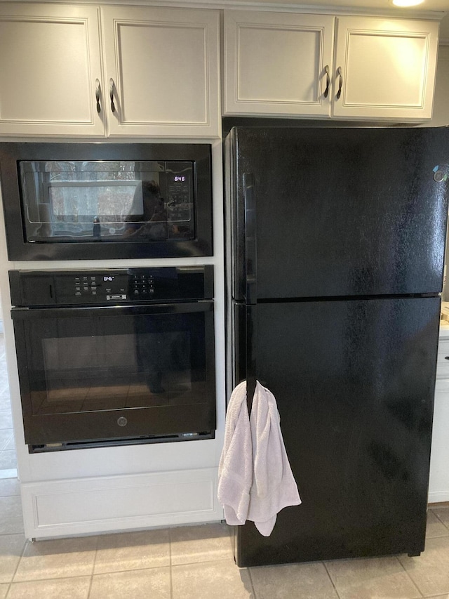 5 Penobscot Way, Harwich, MA 02645 - kitchen featuring light tile patterned floors and black appliances