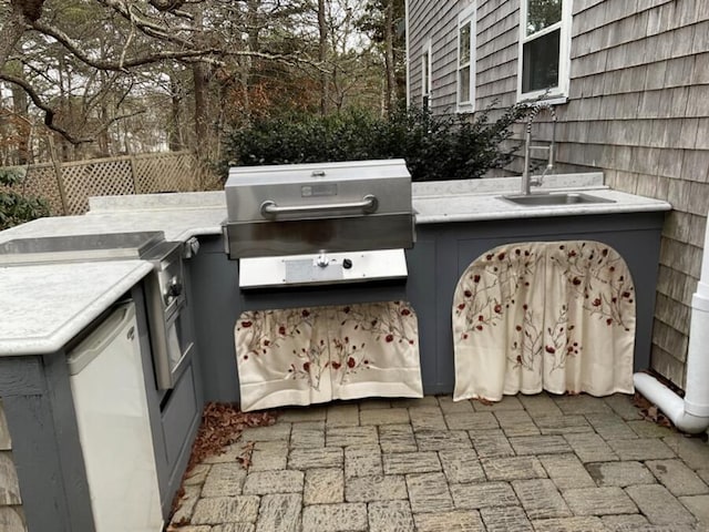 5 Penobscot Way, Harwich, MA 02645 - view of patio / terrace featuring grilling area, a sink, exterior kitchen, and fence