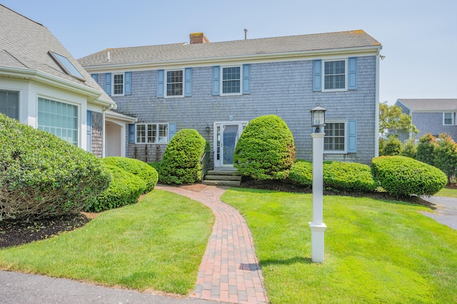 7 Dunes Rd, Harwich Port, MA 02646 - colonial inspired home featuring a chimney, a front lawn, and entry steps