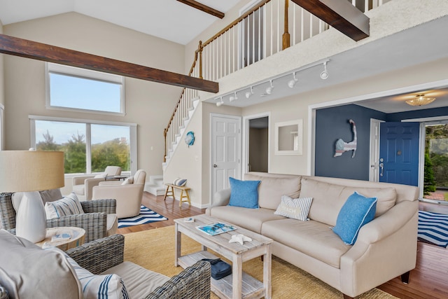 7 Dunes Rd, Harwich Port, MA 02646 - living room featuring stairway, wood finished floors, and lofted ceiling