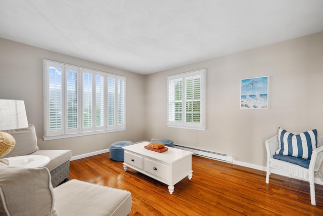 7 Dunes Rd, Harwich Port, MA 02646 - sitting room featuring a baseboard radiator and wood finished floors