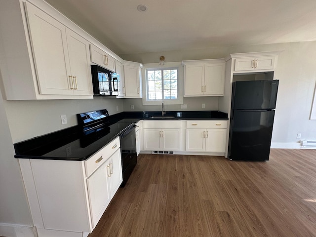 kitchen with black appliances, white cabinets, dark wood-type flooring, and sink