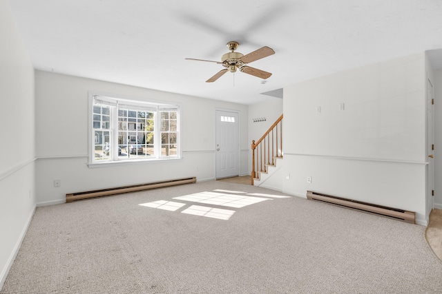 interior space featuring baseboards, carpet floors, a baseboard radiator, stairs, and baseboard heating