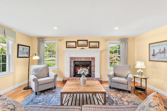 80 Schooner Ln, Hyannis, MA 02601 - living area featuring wood finished floors, a brick fireplace, baseboards, and recessed lighting