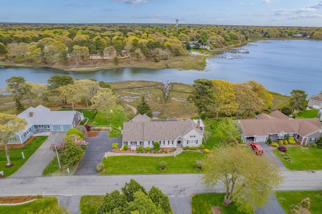 aerial view of a nearby body of water and a heavily wooded area