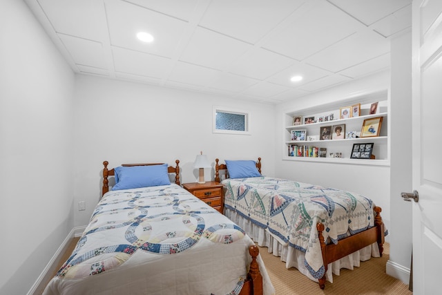 carpeted bedroom featuring baseboards and recessed lighting