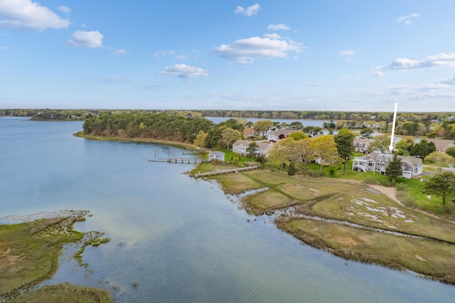 aerial view of property and surrounding area with a nearby body of water