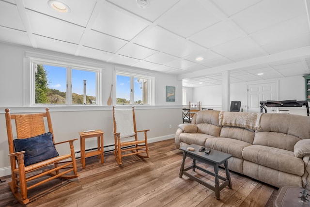 living area featuring hardwood / wood-style floors, recessed lighting, and baseboards