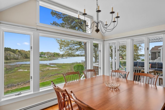 sunroom featuring a baseboard heating unit, a water view, vaulted ceiling, healthy amount of natural light, and a chandelier