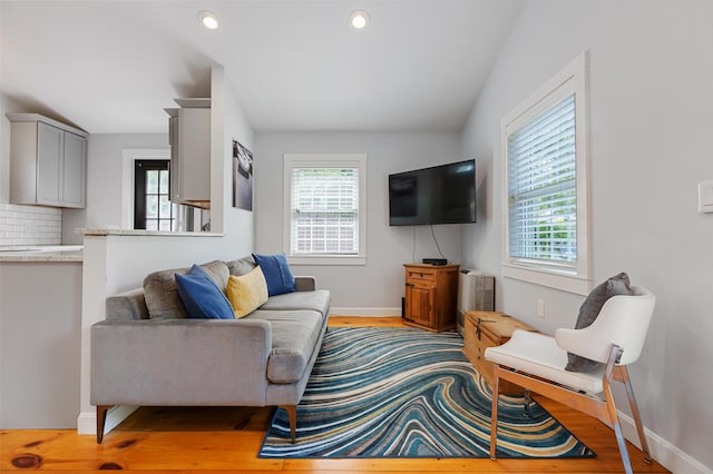 280 Schoolhouse Rd, Eastham, MA 02642 - living room featuring lofted ceiling, baseboards, light wood-type flooring, and recessed lighting