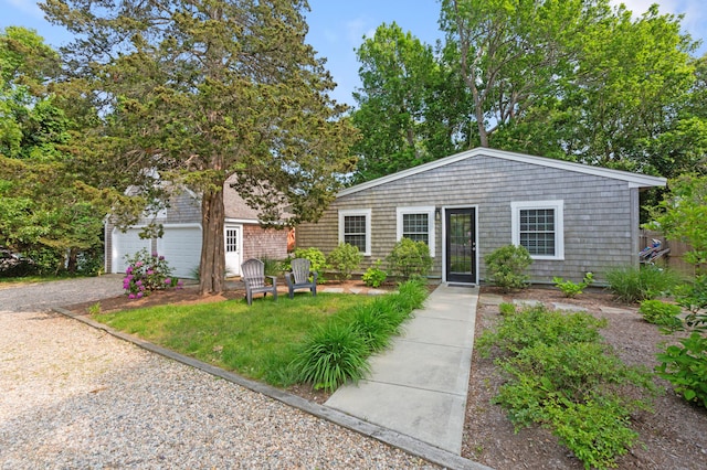 280 Schoolhouse Rd, Eastham, MA 02642 - view of front of house featuring driveway and a garage