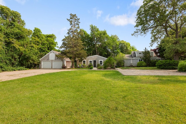 280 Schoolhouse Rd, Eastham, MA 02642 - view of front facade with dirt driveway, a front yard, and an attached garage