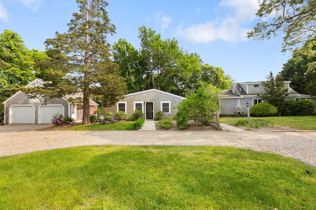 280 Schoolhouse Rd, Eastham, MA 02642 - view of front of property with an outbuilding, a front lawn, and driveway
