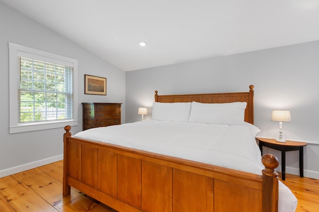 280 Schoolhouse Rd, Eastham, MA 02642 - bedroom featuring lofted ceiling, baseboards, and light wood-style flooring