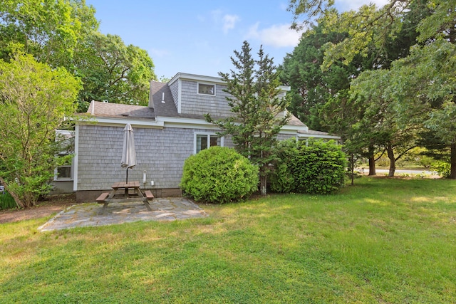 280 Schoolhouse Rd, Eastham, MA 02642 - rear view of house with a patio area and a yard