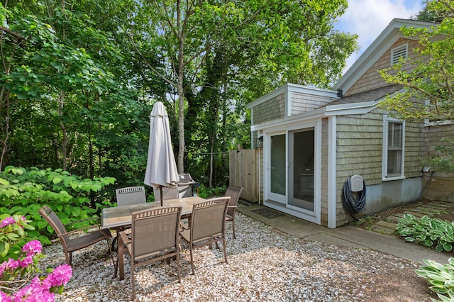 280 Schoolhouse Rd, Eastham, MA 02642 - view of patio featuring outdoor dining space and an outdoor structure