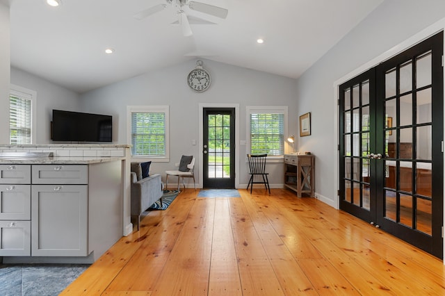 280 Schoolhouse Rd, Eastham, MA 02642 - kitchen featuring french doors, gray cabinetry, vaulted ceiling, light wood-style floors, and open floor plan