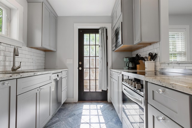280 Schoolhouse Rd, Eastham, MA 02642 - kitchen with appliances with stainless steel finishes, a sink, gray cabinets, and backsplash